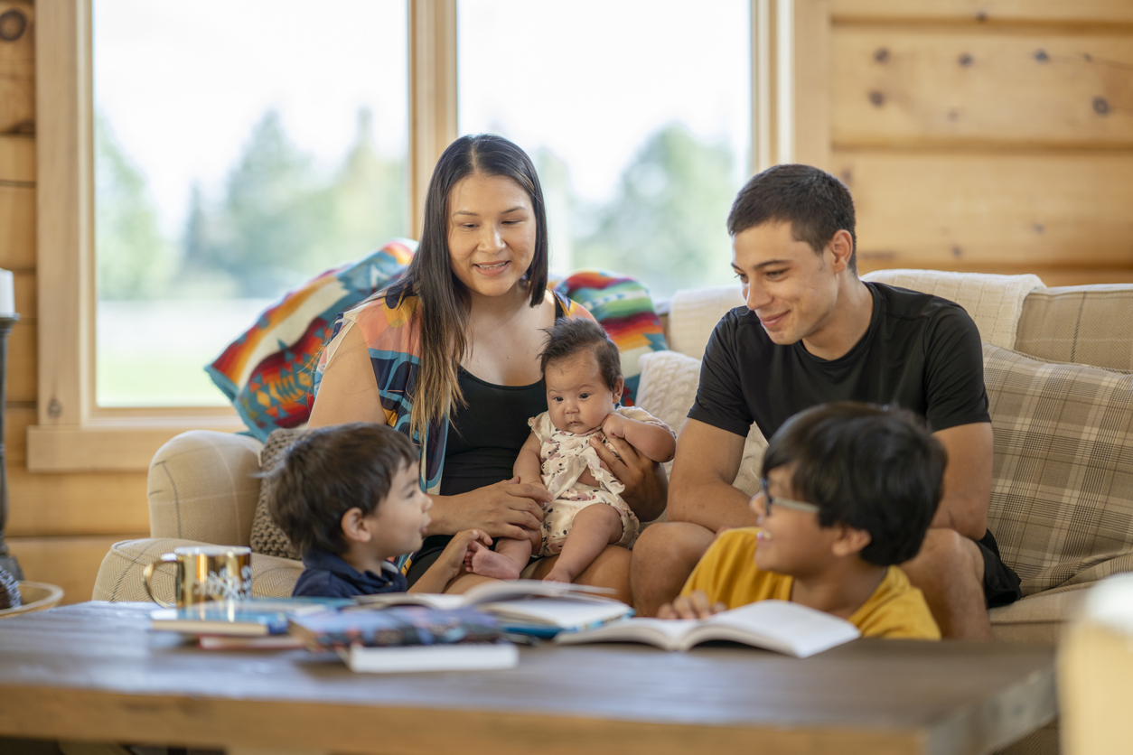 Young Indigenous Canadian family spending time together at home